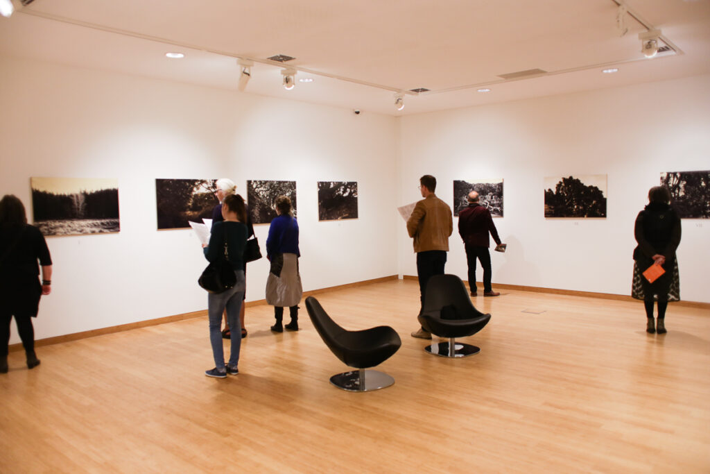 Exposition The Passion in 2018. Museum Nairac. depicting visitors exploring the photoseries by Stein Frayman.