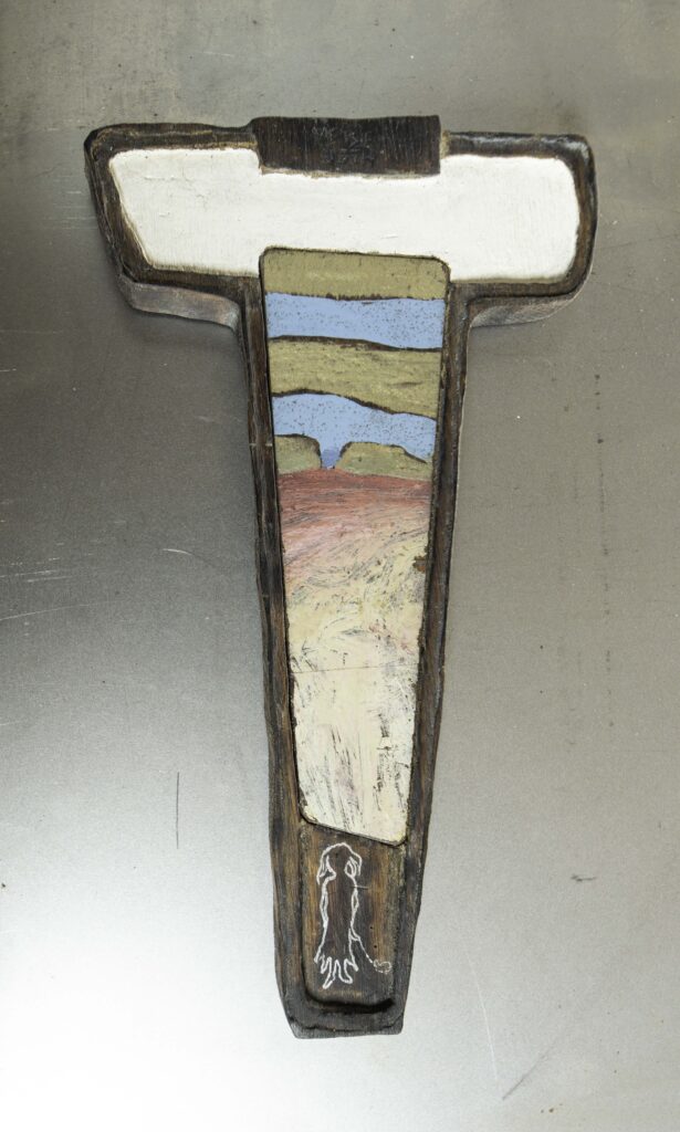 Wooden sculpture with metal and engraving. Copyright Stein Frayman 2024